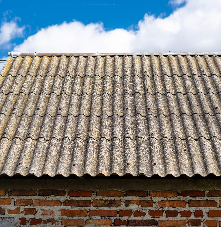 Corrugated asbestos roofing sheets on an industrial building