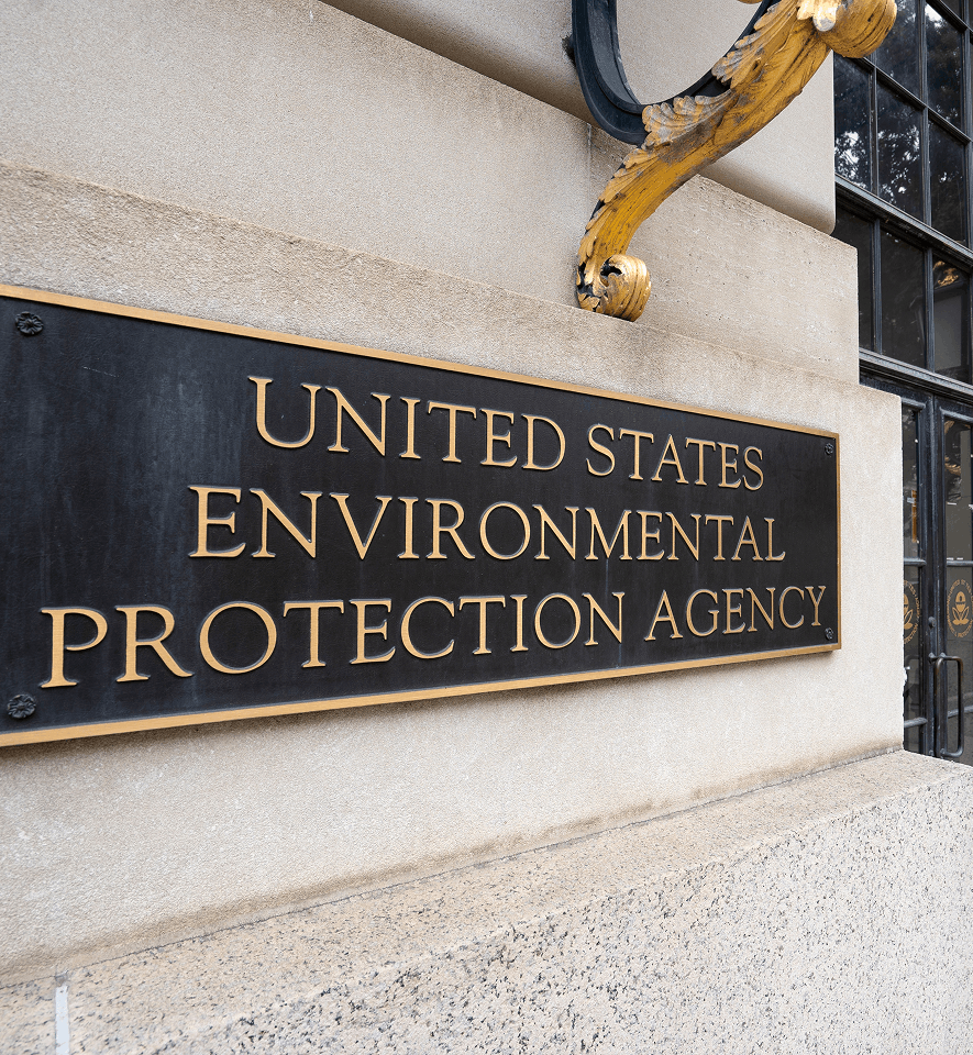 Utah state building with regulatory signage related to asbestos laws